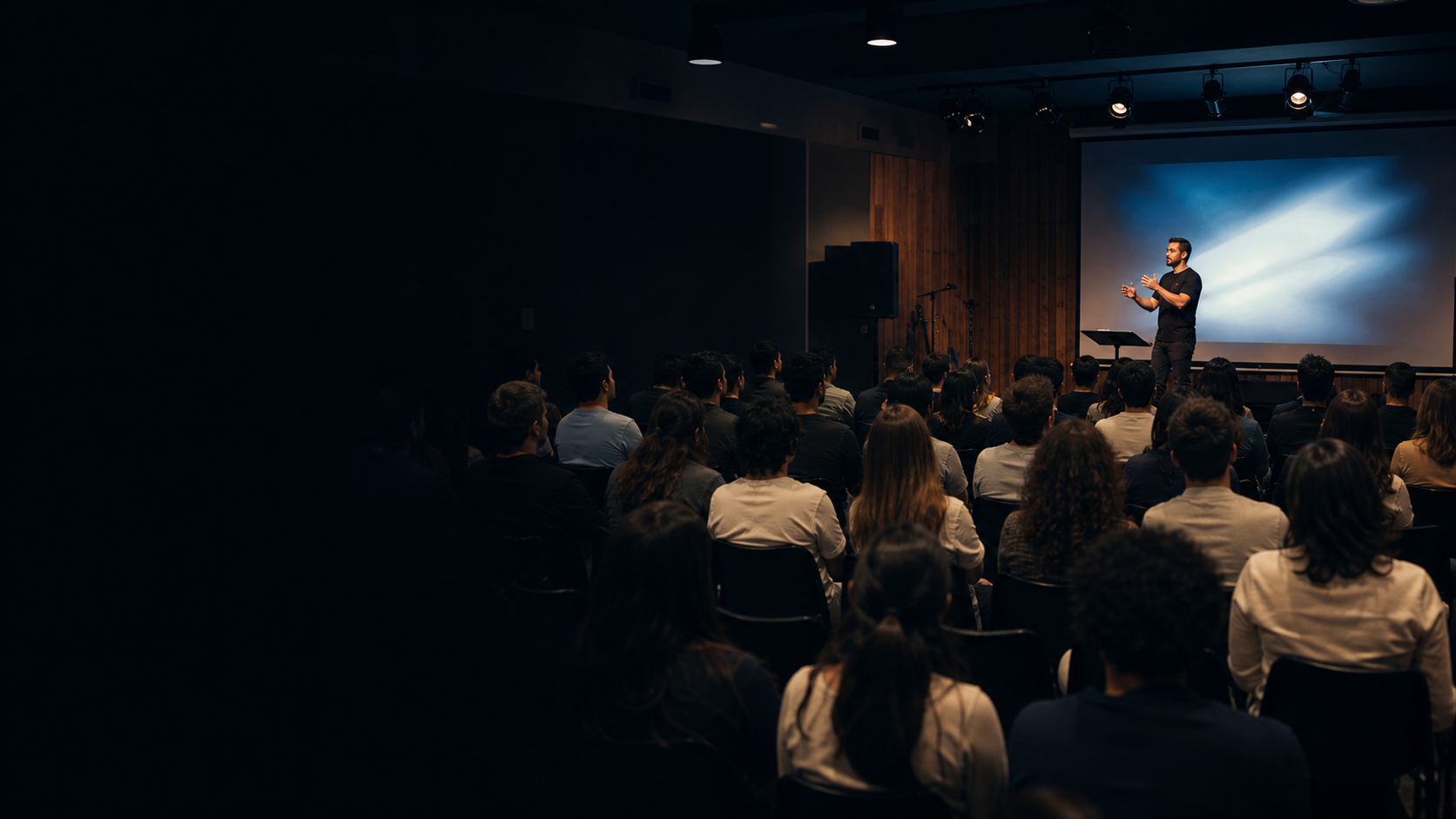 Students and leaders take part in a Bible training session in a bright room.